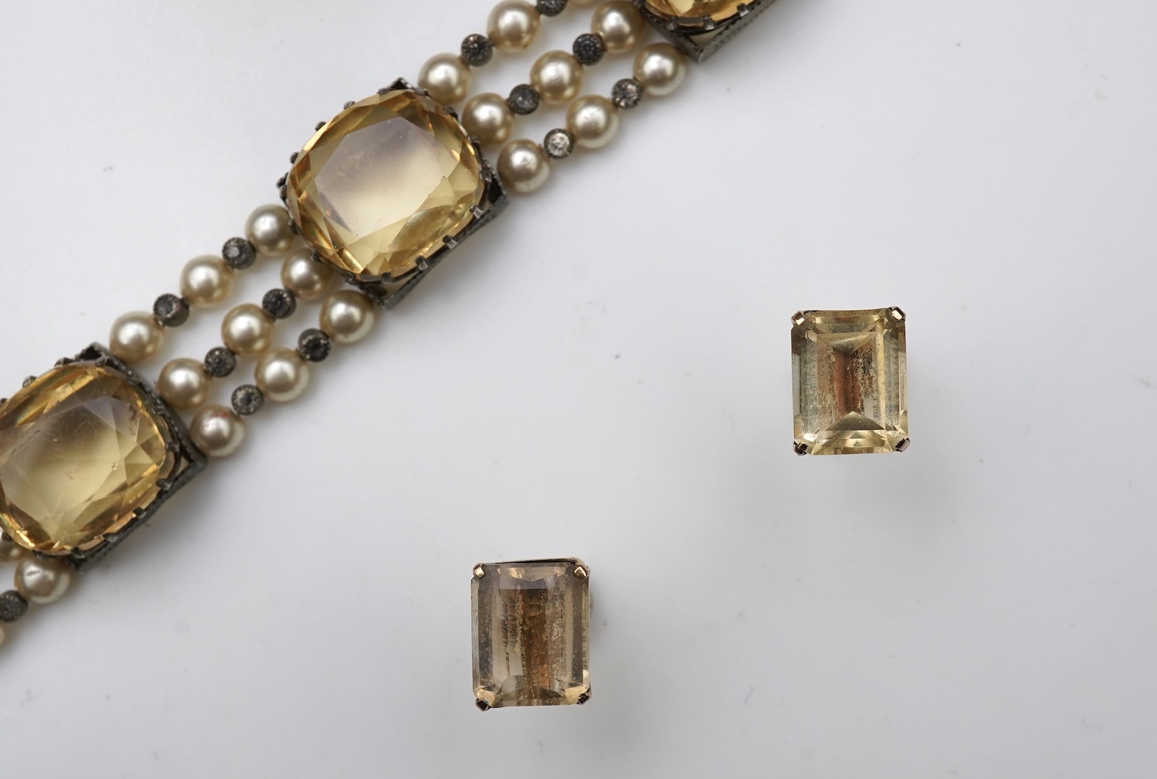 A collection of citrine jewels and a paste bracelet